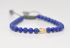 BEADED PULL BRACELET WITH BLUE LAPIS AND GOLD SKULL DETAIL