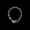 TEXTURED HORSESHOE LINK BRACELET WITH WHITE AND CHAMPAGNE DIAMONDS